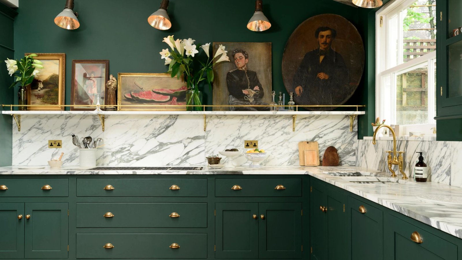 A kitchen with Green Cupboards and Gold 